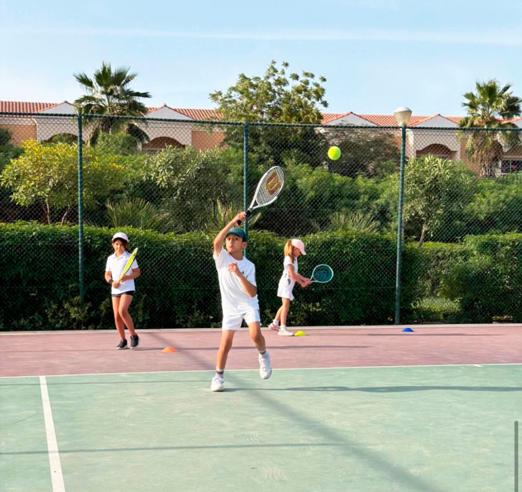Junior player hitting a backhand during practice