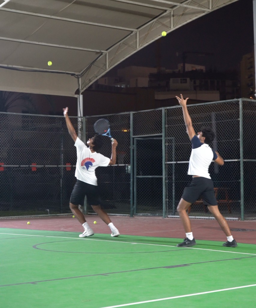 Junior players in action during a tennis session